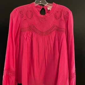 Anthropologie hot pink blouse with cutouts and detailing.